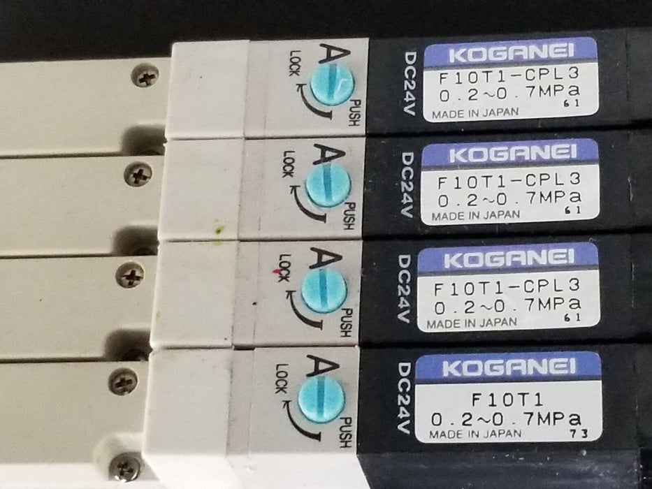 KOGANEI F10M6AJ MANIFOLD W/ FOUR F10T1-CPL3 SOLENOID VALVES, DC24V