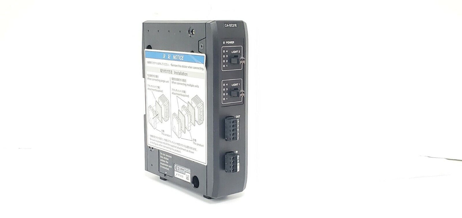 NEW KEYENCE CA-DC21E ILLUMINATION EXPANSION UNIT 12-24VDC 3-6.5A CADC21E